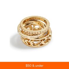 three gold rings are stacked on top of each other, with the words $ 50 & under