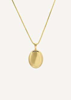 Home is where the heart is. Our Maison Gold Lockets are heirlooms that represent a moment in time. Keep this locket as a family heirloom forever. Wear her blank or get her engraved with your signature letter. To engrave more than one letter, visit HERE.Complete the look with a Rolo Link Chain Necklace or a Box Chain Necklace. Photo dimensions: 14mm x 11.5mmTo add a photo inside, simply open the locket and carefully press the photo into place. Our lockets do not have a separate opening for a phot Oval Locket Necklace With Detachable Pendant As Gift, Elegant Oval Link Necklace For Keepsake, Elegant Oval Link Keepsake Necklace, Timeless Oval Locket Necklace For Gift, 14k Gold Oval Pendant Locket Necklace, Timeless Gold Oval Locket Necklace, Elegant Oval Pendant Locket Necklace For Keepsake, Timeless Oval Locket Necklace, Oval Necklaces With Detachable Pendant For Anniversary