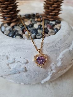 Elevate your style with this stunning necklace featuring a vibrant purple zircon stone. Handcrafted with care, this unique piece adds a touch of elegance to any outfit. The rich, deep hue of the zircon stone is complemented by a delicate chain, creating a perfect blend of sophistication and charm. Treat yourself or surprise a loved one with this exquisite purple zircon necklace. Cubic Zirconia Heart Cut Birthstone Necklaces, Heart Cut Birthstone Necklace In Cubic Zirconia, Cubic Zirconia Birthstone Heart Pendant Necklace, Fine Jewelry Purple Diamond Necklace, Purple Cubic Zirconia Necklaces For Anniversary, Purple Diamond Necklace Fine Jewelry, Purple Cubic Zirconia Necklace For Anniversary, Heart Cut Cubic Zirconia Gemstone Necklaces, Purple Diamond Necklace In Fine Jewelry Style