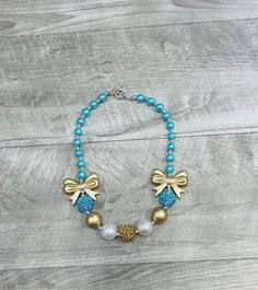 Necklaces are not toys and should not be left with children unattended. Bow Necklace, Pandora Charm Bracelet, Charm Bracelet, Glitter, Necklaces, Turquoise, Toys, Gold