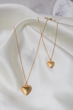 Personalized heart-shaped photo locket necklace - 18K gold plated - a treasured keepsake for her or a gift for her. Small Heart: 1.33cm/ 0.52in Big Heart: 1.9cm/ 0.78in Chain 26cm/ 10in Gold-tone Gold Plated Locket Necklace Gift, Dainty Gold Plated Locket Necklace Gift, Vintage Gold Plated Heart Necklace, Vintage Gold-plated Heart Necklace, Gold Plated Tarnish Resistant Locket Necklace As Gift, Gold-plated Tarnish-resistant Locket Necklace As Gift, Gold Heart-cut Locket Necklace For Gift, Gold Plated Locket Necklace For Wedding, Gold Plated Heart Locket Necklace As A Gift