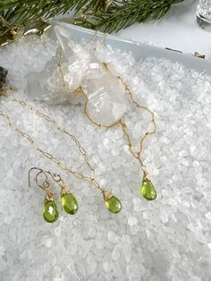 🌴 VACATION ALERT 🌴 I will be on vacation from 8/8-8/23. If you place an order after 8/5, it WILL NOT SHIP UNTIL 8/25.Beautiful faceted Peridot Briolettes are hand wrapped in the pretty matching set.Necklace measures 18".Bracelet measure 7" & can be shortened on any of the links.Earrings dangle from gold filled ear wires & include silicon ear backs.Beautiful set for those August Birthdays, lovers of Green, or St. Patrick's Day! August Birthdays, August Birthday, Peridot Necklace, Earring Gift, Set Necklace, Hand Wrap, Earrings Dangle, The Pretty, Necklace Bracelet