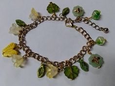 Embrace nature and whimsy with this fairycore-inspired charm bracelet, perfect for lovers of cottagecore, naturecore, and earthy aesthetics. Featuring an enchanting mix of glass and ceramic beads, this bracelet is adorned with delicate bee charms, pretty flowers, lush green leaves, and a cheerful yellow butterfly centerpiece. The chain is made from upcycled mixed metal, thrifted for an eco-friendly and sustainable touch. Ideal for those who enjoy magical, garden-inspired accessories, this unique piece adds a touch of woodland fantasy to any outfit. Size: Bracelet is adjustable up to 9 inches. Butterfly Centerpiece, Fairycore Jewelry, Butterfly Centerpieces, Seed Bead Flowers, Embrace Nature, Magical Garden, Yellow Butterfly, Butterfly Flower, Bee Charms