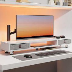 a computer monitor sitting on top of a white desk