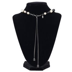 Authentic Chanel Pearl Bead Long Necklace. Features a beautifully detailed Coco Pearl Bead Enamel CC Baroque Long Necklace. This elegant extra long necklace features smooth glass beads, resin baroque pearls, and a textured pendant with a CC logo. This necklace can be worn long or short as shown. Chanel stamp is present and pictured. Rare. Chain: 22" with lobster clasp Marked: A11P Made in 2011 Made in France Luxury Beaded Long Necklace, Elegant Pearl Necklace With Round Beads And Chain, Luxury Long Beaded Chain Necklace, Elegant Beaded Lariat Necklace, Luxury Pearl Chain Necklace With Round Beads, Luxury Necklace With Pearl Chain And Round Beads, Luxury Pearl Necklace With Polished Beads, Luxury Necklaces With Faceted Beads For Jewelry Making, Luxury Beaded Necklace With Round Beads