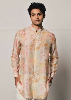 Patchwork print shirt style mal cotton kurta featuring a mandarin collar, cuffed sleeves and a curved hemline. This is a 2 piece set complete with a cream trouser style cotton pajama. Cotton Bandhgala With Printed Motifs For Festive Occasions, Summer Straight Kurta With Set-in Sleeves, Spring Festive Kurta With Set-in Sleeves, Spring Festive Bandhgala With Printed Motifs, Festive Spring Bandhgala With Printed Motifs, Traditional Spring Kurta With Set-in Sleeves, Cotton Bandhgala Straight Kurta For Transitional Season, Cotton Bandhgala With Printed Motifs For Eid, Summer Cotton Kurta With Set-in Sleeves