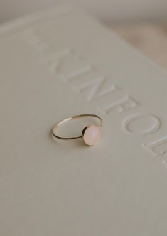 Our Rosie ring is made with a stunning Rose Quartz stone. Known as the crystal of unconditional love, it's said to boost feelings of self-love and foster loving relationships with others. It’s a crystal connected to the heart chakra which colors our life with compassion, love and beauty. 8mm round or 5x7mm oval rose quartz stone. Ring band measures 1mm wide. Available in 14kt Gold Fill + Sterling Silver. Rediet pairs it with our Supermoon Ring and Teeny-Tiny Band. Kayla pairs it with two Confett Confetti Rings, Relationship Jewelry, Loving Relationships, Love And Beauty, Everyday Wear Jewelry, Jewelry Photoshoot, Gift Inspo, Heart Shaped Jewelry, Rose Quartz Stone