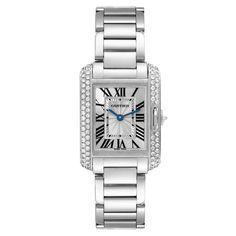 Cartier Tank Anglaise White Gold Diamond Ladies Watch WT100008. Quartz movement. 18k white gold case 30.2 x 22.7 mm. Circular grained crown set with an original Cartier factory diamond. 18k white gold original Cartier factory diamond bezel. Scratch resistant sapphire crystal. Flinque and silvered dial with black Roman numerals. Sword shaped blued steel hands. Secret Cartier signature at X. 18k white gold bracelet with hidden butterfly clasp. Fits 6" wrist. Cartier Diamond Watch With Palladium Hardware, Cartier Diamond Watch With Round Dial, Cartier Diamond Watch With Diamond Accents, Luxury Cartier Diamond Watch With Diamond Accents, Luxury Cartier Diamond Watch For Anniversary, Cartier Diamond Watch With Brilliant Cut, Cartier Diamond Watch For Wedding, Timeless Cartier Diamond Watch With Palladium Hardware, Cartier Diamond Watch With Diamond Hour Markers For Anniversary