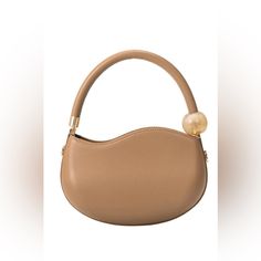 With Its Structured Shape And Marbled Pearl Accent, This Small Handbag Is Spacious Enough To Carry Your Phone, A Cardholder, Keys, And Your Favorite Compact Beauty Product. Opt To Go Hands-Free With The Crossbody Strap. Recycled Vegan Leather 8"W X 5.5"H X 1"D Handle Drop: 5.5" Strap Length: 45.5 -51.5" Zipper Closure Gold-Tone Hardware Oeko-Tex Certified Lining Fits Up To An Iphone 11 Pro Max Product No. Bc3240iv Color Tan Brown Bag With Detachable Strap And Round Handle, Brown Bags With Detachable Strap And Round Handle, Cream Top Handle Bag With Pearl Detail, Cream Top Handle Bag With Pearl Handle, Brown Top Handle Bag With Single Handle, Brown Bag With Removable Pouch And Round Handle, Cream Bags With Pearl Handle For Daily Use, Versatile Brown Bag With Round Handle, Brown Bag With Top Carry And Round Handle