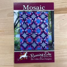 the front cover of mosaic running dove quilts, featuring a purple and blue design