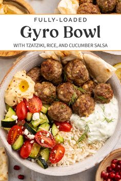 a bowl filled with meatballs, rice and cucumber salsa next to other foods