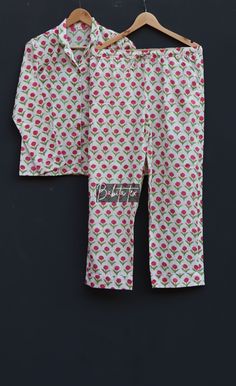 "Designed and customized in our India store, the love and care we put into every PJ will stand out to you at the moment you see it. Full sleeve shirt with buttons and loose fit trousers. Completely handmade in Jaipur from 100% pure cotton fabric. Comes in S/M/L/XL sizes, but without any complications can be adjusted to individual measurements. Note: The color and brightness of actual product may vary due to digital photography and photo editing. We crossed check each and every product before lis White Long Pants Set For Sleepovers, White Cotton Pajama Party Sets, Cotton Sleep Sets With Long Pants, White Long Pants Sets For Bedtime, White Pajama Party Sets With Long Pants, Matching Pink Loungewear Sets, Pink Matching Loungewear Sets, Pink Cotton Sleepover Set, White Long Pants Pajama Party Sets