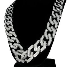 Sand Blast Cuban link hip hop chain. 30" inches long and 20 mm wide. Squared cuban links chain design. Chunky chain weighs 250 grams. Sand blast looks like crushed stones. Silver tone over nickel-free alloy metal. Stylish fold-over box clasp closure. High quality - looks like a million bucks. Matching sand blast bracelet is available. 100% FREE SHIPPING in USA. Order now! Silver Cuban Link Bling Necklace, Chunky Cuban Link Necklace For Streetwear, Chunky Chain Cuban Link Necklace For Streetwear, Dazzling Diamond-cut Cuban Link Necklace, Silver Diamond-cut Cuban Link Necklace, Hip Hop Chains, Crushed Stone, Cuban Link, Cuban Link Chain