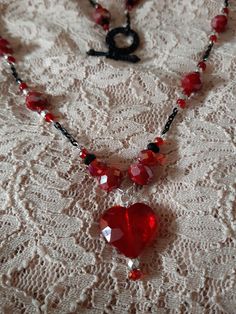 Bead and Chain Red and Black Single Strand Handmade Beaded Necklace with Heart Pendant Valentine's Day Beaded Party Necklace, Heart Shaped Beaded Chain Jewelry For Party, Heart-shaped Beaded Chain Jewelry For Party, Heart-shaped Beads For Valentine's Day Gift, Valentine's Day Necklaces With Colorful Beads, Heart Pendant Beaded Necklace For Parties, Heart-shaped Necklace With Colorful Beads For Parties, Party Beaded Necklace With Heart Pendant, Party Heart Pendant Beaded Necklace