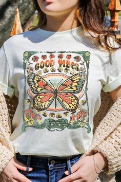 Spread good vibes with our Butterfly Graphic Tee! Made with high quality materials and a stylish design, this tee will make a statement wherever you go. The butterfly graphic adds a touch of beauty and positivity to your wardrobe. Feel good and look good with our Good Vibes Graphic Tee! Unisex Crew Neck Short Sleeve .High Quality Direct To Film Printed Graphic Design.100%COTTON,HEATHER(52%COTTON,48%POLY),ATH.HEATHER,BLACK HEATHER(90%COTTON,10%POLY) Good Vibes Graphic, Concert Festival, Butterfly Graphic, Romper And Jacket, Fall Denim, Film Prints, Graphic Design Print, Knitted Coat, Kimono Cardigan