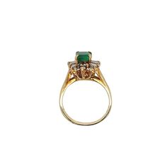 Ring Details: ✔ Gold Karat: 14K ✔ Ring Size: 7 ✔ Ring Weight: 3.9 grams ✔ Mounting: Prong ✔ Shank: Cathedral ✔ Diamonds: (6 baguette-cut diamonds, 0.24ctw) (14 round cut diamonds, 0.19ctw)  Emerald Details: ✔ Carat: 1.00 ✔ Cut: Emerald ✔ Origin: Colombia ✔ Color: Green (deep) ✔ Clarity: Very good ✔ Luster: Excellent Vintage natural Emerald and natural diamond ring in 14k solid yellow gold. This vibrant Emerald bears excellent color and luster. It's well contrasted by a round and baguette-cut dia Yellow Gold Ring With Baguette Cut Halo Setting, Classic Gold Marquise Emerald Ring, Classic Marquise Emerald Ring In Gold, Heirloom Yellow Gold Baguette Cut Cluster Ring, Heirloom Gold Marquise Cut Emerald Ring, Heirloom Marquise Cut Gold Emerald Ring, Formal Marquise Yellow Gold Emerald Ring, Yellow Gold Emerald Cut Halo Ring For Formal Events, Formal Yellow Gold Emerald-cut Halo Ring