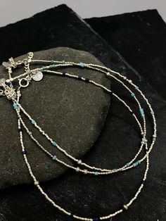 This handmade anklet is composed of small grain silver beads combined with natural lapis lazuli OR turquoise beads, placed randomly along the string. It closes with a simple spring ring and we added 4 cm silver chain that allows for a slight size adjustment. All silver parts are hand crafted in 95-98% Silver by Thai Karen hill-tribe artisans. The Karen are a group of ethnic peoples who reside primarily in southern and southeastern Burma and in northern and north-eastern Thailand. Every piece is Bohemian Sterling Silver Anklets With Silver Beads, Blue Beaded Bracelets With Silver Beads For Festivals, Sterling Silver Blue Jewelry With Tiny Beads, Blue Sterling Silver Jewelry With Tiny Beads, Bohemian Sterling Silver Beaded Bracelet With Tiny Beads, Sterling Silver Bohemian Beaded Bracelet, Blue Festival Bracelets With Silver Beads, Blue Bracelets With Silver Beads For Festival, Handmade Bohemian Sterling Silver Anklets