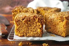 several pieces of cake sitting on top of a cooling rack