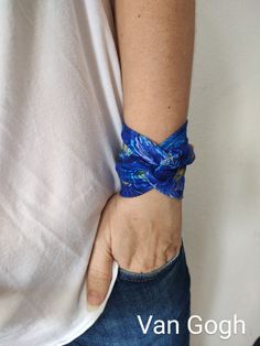 Wide floral twist wrist cuff bracelet - PLEASE CHOOSE YOUR PATTERN from the drop down menu *Handmade with love and care in a smoke free home *Every wrist cuff is sewn by me *No seam at the back *Double layered *Ideal for covering wrist tattoos *Stretchy and soft cotton jersey *Fabulous accessory for your outfit *Goes well with everything *Can be worn with the twist in front or at the back of your wrist *Unique and standing out PATTERN: Patterns available in the drop down menu MATERIALS: stretchy jersey cotton SIZE:  CHOOSE YOUR SIZE from the drop down menu If you choose CUSTOM SIZE please measure your wrist circumference and write that in the "Note to Seller" section when ordering. LENGTH: (the widest part under arm) *About 10 cm - 3.9 inches long Please note that the color may be slightly Adjustable Wearable Art Cuff Bracelet Gift, Trendy Adjustable Blue Cuff Bracelet, Cuff Wristband With Bracelet Strap Gift, Adjustable Cuff Bracelet Gift, Adjustable Wearable Art Bangle As Gift, Cuff Wristlet As Gift, Cuff Bracelets With Wrist Strap For Gift, Cuff Bracelet Gift, Adjustable Cuff Bracelet With Wrist Strap