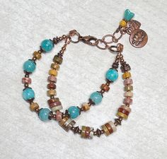 This boho bracelet was created using pretty blue Quartzite stone beads framed in antique copper bead caps, Picasso Jasper gemstone beads in two different sizes, tiny sand-color Picasso seed beads, and antique copper accents throughout. Bracelet closes with a lobster clasp, and has an extender chain finished with a copper lotus charm, a heart charm, and a small bead dangle.  This boho bracelet is perfect for everyday, and makes a wonderful gift! Bracelet best fits a wrist size between 6-1/2" - 7-1/4".  If a longer extender is needed, please leave a note at checkout. Thank you for shopping with The Lucie Collection! Nickel-free Bohemian Beaded Bracelets For Healing, Bohemian Adjustable Copper Bracelets, Adjustable Bronze Bohemian Bracelets, Bohemian Bracelets With Czech Glass Gemstone Beads, Bronze Beaded Bohemian Bracelets, Bohemian Czech Glass Gemstone Beads Bracelets, Bohemian Brown Czech Glass Bracelets, Bohemian Beaded Copper Bracelets, Bohemian Copper Beaded Bracelets