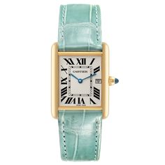 Cartier Tank Louis Yellow Gold Teal Leather Strap Mens Watch W1529756. Quartz movement. 18k yellow gold case 25.0 x 33.0 mm. Circular grained crown set with a blue sapphire cabochon. . Scratch-resistant mineral crystal. Silvered opaline dial with black radial Roman numeral hour markers and inner minute track. Sword shaped blue hands. Date calendar at 3 o'clock aperture. Secret Cartier signature at VII. Teal leather strap with 18K yellow gold tang buckle. Vintage Cartier Yellow Gold Watch, Vintage Yellow Gold Cartier Watch, Vintage Cartier Gold Watch Accessories, Vintage Gold Cartier Watch Accessories, Classic Yellow Gold Watch Bands With Rectangular Dial, Cartier Gold Watch With Rectangular Dial, Gold Cartier Watch With Rectangular Dial, Classic Yellow Gold Cartier Watch Accessories, Timeless Gold Cartier Watch Accessories