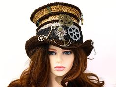 This Steampunk top hat adds a fun and funky Victorian feel to your renfair costume, a Steampunk festival outfit, a convention, a concert, or just for fun! Crocheted by hand, I've worked this in an ombre from brown to rusty gold, with bands of brown and a brown brim. Gears and keys abound, including the brim and on the ridges, as well as a spare pair of tailors shears dangling at the top. I've also wired the brim so you can play with different looks. Made from premium acrylic, you can wear this hat all year. Firm enough to hang on a peg or rest on your shelf without losing shape, soft and comfortable on your head. This hat has some stretch for an adjustable head size fit. -6" rise, 2" wired brim -Fits 21-23.5" head circumference How to measure your head: - Using a fabric tape measure or a s Whimsical High Crown Hat For Themed Events, Steampunk Brimmed Costume Hat For Cosplay, Fitted Steampunk Hat For Costume Party, Vintage Fitted Hat For Cosplay, Fitted Vintage Hat For Cosplay, Steampunk Brimmed Top Hat For Costume Party, Steampunk Brimmed Mini Hats For Costume Party, Steampunk Brimmed Mini Hats For Cosplay, Steampunk Costume Hat With Curved Brim