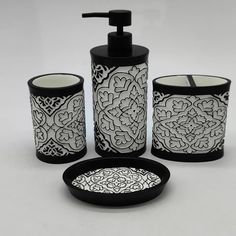 a black and white bathroom set with soap dispenser