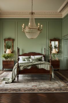 a bedroom with green walls and wooden furniture, including a large bed in front of a chandelier