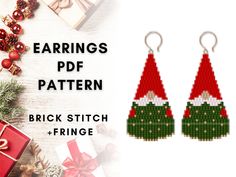 two christmas themed earrings with red and green trimmings on them, next to presents