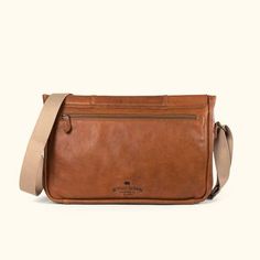 Walker Leather Messenger Bag - Rustic Tan | Buffalo Jackson Luxury Flap Bag For Travel, Luxury Travel Flap Bag, Classic Cognac Shoulder Bag For Travel, Timeless Travel Shoulder Flap Bag, Classic Saddle Shoulder Bag For Everyday Carry, Classic Everyday Carry Saddle Shoulder Bag, Classic Saddle Bag With Adjustable Strap For Everyday, Classic Shoulder Saddle Bag For Everyday Carry, Timeless Crossbody Flap Bag For Travel