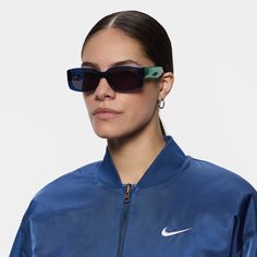 Meet the Nike Variant I. Made with mismatched details and a chunky, rectangular frame, these shades perfectly combine your sporty attitude and bold, streetwear aesthetic. Bonus: they’re made from at least 20% recycled content by weight. Streetwear Aesthetic, Navy Fashion, Midnight Navy, Shades, Street Wear, Women Accessories, Sunglasses, Lifestyle, Nike