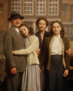 an old time family posing for a photo