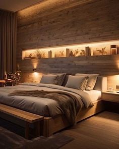 a large bed sitting in a bedroom next to two lamps on either side of it