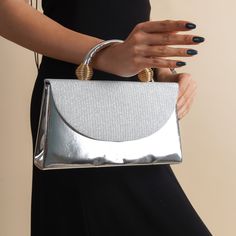 The sides and chain strap of this women evening clutch bag made of faux leather and glitter fabric are silver colored. Basic make-up supplies, cell phone, key chain, credit card and money can easily fit into this luxury mini bag. The interior of this evening bag has a single compartment and is lined with suede. It has a 120 cm removable chain strap. This wedding clutch is completely handmade. Features: Shiny fabric. Fits basic makeup, cell phone, key chain, credit card and money. Suede lined and Luxury Silver Wallet On Chain For Formal Events, Luxury Mini Bag, Silver Clutch Purse, Silver Clutch Bag, Evening Clutches, Silver Bag, Silver Clutch, Silver Bags, Basic Makeup