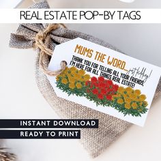 an instant printable real estate pop - up tag is shown on top of a burlap bag