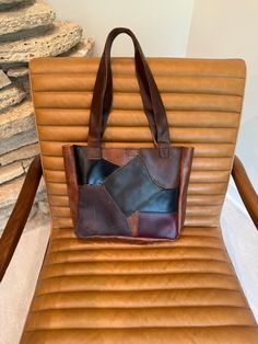 Upcycled custom leather patchwork tote bag, custom made. Various leathers utilized to formulate patch worked bag, with brown leather handles. Leather Patch Tote Bag For Everyday Use, Everyday Use Tote Bag With Leather Patch, Brown Recycled Leather Shoulder Bag, Brown Recycled Leather Tote Bag, Brown Recycled Leather Satchel Bag, Brown Recycled Leather Satchel, Brown Soft Recycled Leather Shoulder Bag, Brown Soft Leather Recycled Shoulder Bag, Brown Rectangular Bag With Leather Trim