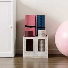 there is a pink ball and some yoga mats