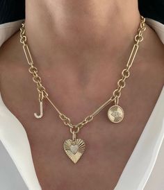 This beautiful charm features a pave diamond heart set on a fluted 14K Yellow Gold heart. 14K Yellow Gold Charm only, no chain Diamond enhancer clasp measurement: 5mm x 4mm Heart measurement: 18mm x 20mm 49 round diamonds 0.12ct 3.38 grams Bail opens to fit on a variety of chains Elegant 14k Gold Heart Charm, Classic Diamond Jewelry With Heart Charm, Elegant Heart Charm For Anniversary, Elegant Yellow Gold Heart Charm, Yellow Gold Heart Charm Jewelry In Cubic Zirconia, Yellow Gold Jewelry With Heart Charm In Cubic Zirconia, Classic Heart Pendant Jewelry With Charms, Yellow Gold Cubic Zirconia Jewelry With Heart Charm, Diamond Charms Jewelry For Valentine's Day