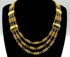 "Etruscan Monet Byzantine Hammered Gold Tone Vintage Choker c. 1970s -Hammered shiny gold tone panels with three rows of stacked gold tone rings in between each panel -Signed Monet -Excellent vintage condition with age appropriate wear -Adjustable length, measures approximately 17\" at longest, 15\" at shortest. Hook closure" Adornment Jewelry, Black Tissue Paper, Vintage Choker, Hammered Gold, Gold Gilding, Choker Necklaces, Matte Gold, Photo Jewelry, Statement Earrings