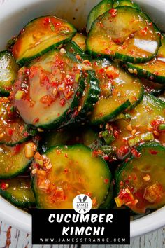 cucumber kimchi in a white bowl on a wooden table