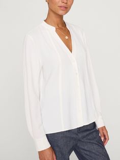 Galey button-down long sleeve white blouse front view Timeless Daywear Tops With Placket, Timeless Tops With Placket For Daywear, Timeless Spring Tops With Button Closure, Timeless Workwear Tops With Hidden Button Closure, Timeless Tops With Button Closure, Timeless Spring Blouse With Relaxed Fit, Spring Timeless Blouse With Relaxed Fit, Classic Blouse With Shirttail Hem For Work, Elegant Blouse With Shirttail Hem And Placket