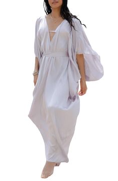 Perfect for poolside hangs or kicking it in the sand, this tie-front kaftan is the perfect accessory to add to your sun-loving wardrobe. V-neck
 Short sleeves 100% polyester satin Hand wash, line dry
 Imported Model stats: 5'10", 32" bust, 25" waist, 36" hip. Model is wearing size One Size. Flowy V-neck Kaftan For Day Out, Chic Unlined Spring Cover-up, Chic V-neck Summer Kimono, Bohemian V-neck Tie Waist Cover-up, Chic Spring Unlined Cover-up, V-neck Summer Kaftan For Vacation, Chic Summer Wrap Cover-up, Spring Bohemian Tie Waist Cover-up, V-neck Beach Dress With Tie Waist As Beach Cover-up