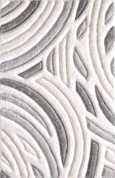 a close up view of an area rug with grey and white designs