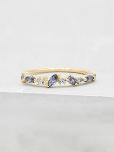 This cluster ring is encrusted with a series of round, oval and pear shaped cubic zirconia stones. The ring is made of gold plated brass. Ring is about 3 mm in height. Stones cover only half of the band. The Cubic zirconias are light sapphire and aquamarine colored. This stacker is perfect as a fashionable piece to enhance your outfit or wear as a placeholder for your engagement ring or wedding band! Please read my shop policies to learn more about the composition and proper care for each item p Birthstone Stacking Rings, Sterling Silver Cleaner, Body Accessories, Ring Inspo, Ringe Gold, September Birthstone, Brass Ring, Pretty Rings, Ring Fit