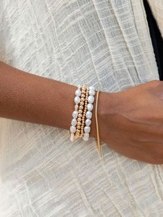 "Beautified with an assemblage of lustrous white freshwater pearl beads, this 18k gold filled pearl bracelet alludes to the soothing sands of Hawaii's shores. Wear this gold pearl bracelet alone or stacked for a classically elegant look. ✦ DETAILS ✦ ✧ Name: Hiwahiwa (HEEvah HEEvah) - precious, beloved, indulged. ✧ Adjustable Length from: 7\"-8.5\". ✧ White Freshwater Pearls. ✧ 14kt Gold Filled Components, Extender, and Clasp. ✧ All Ke Aloha Jewelry pieces come packaged thoughtfully, beautifully, Pearl White Single Strand Beaded Bracelets, Pearl White Single Strand Beaded Bracelet, Pearl White Beaded Bracelet, Elegant White Stretch Bracelet For Beach, White Jubilee Stretch Bracelet, White Single Strand Beaded Bracelet For Gift, Elegant Hand-strung Stretch Bracelet For Beach, Elegant Stretch Bracelet With Round Beads For Beach, White Bracelets With Pearl Charm For Beach