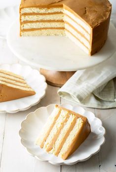 there is a slice of cake on the plate next to it and another piece has been cut