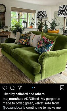 a living room filled with green couches and pillows