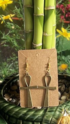 Ankh dangle earrings in rustic gold color Nickel-free Ankh Gold Earrings, Gold Copper Chandelier Earrings, Gold Ankh Metal Jewelry, Gold Ankh Shaped Metal Jewelry, Antique Gold Copper Drop Earrings, Gold Copper Chandelier Earrings As Gift, Gold Copper Chandelier Earrings For Gift, Ankh Shaped Metal Earrings For Gift, Ankh-shaped Metal Earrings For Gift