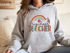 Preschool Teacher Hoodie, Preschool Hoodie, Pre-K Teacher Teacher Hoodie, Cute Teacher Hoodie, Preschool Teacher Hoodie    Hi! Welcome to✨Northstar ✨ ✨As the weather gets colder, you want clothes that keep you and your body warm. Here, Northstar  is ready to keep you warm with its unique designs..✨ ✨Product Features✨ 👉Medium-heavy fabric (8.0 oz/yd² (271.25 g/m 👉Loose fit 👉Runs true to size 👉50% cotton, 50% polyester 👉Tear-away label 👉Youth Hoodies do not have drawcord for added safety ✨Ca Casual School Fleece Hoodie, Casual Fleece Hoodie For School, Cotton Hooded Sweatshirt For School, School Fleece Sweatshirt With Letter Print, School Hoodie Sweatshirt With Drawstring Hood, School Spirit Hooded Hoodie For College, School Spirit Hoodie For College, College Hoodie With School Spirit, School Hoodie With Drawstring Hood