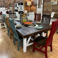 a wooden table with many chairs around it